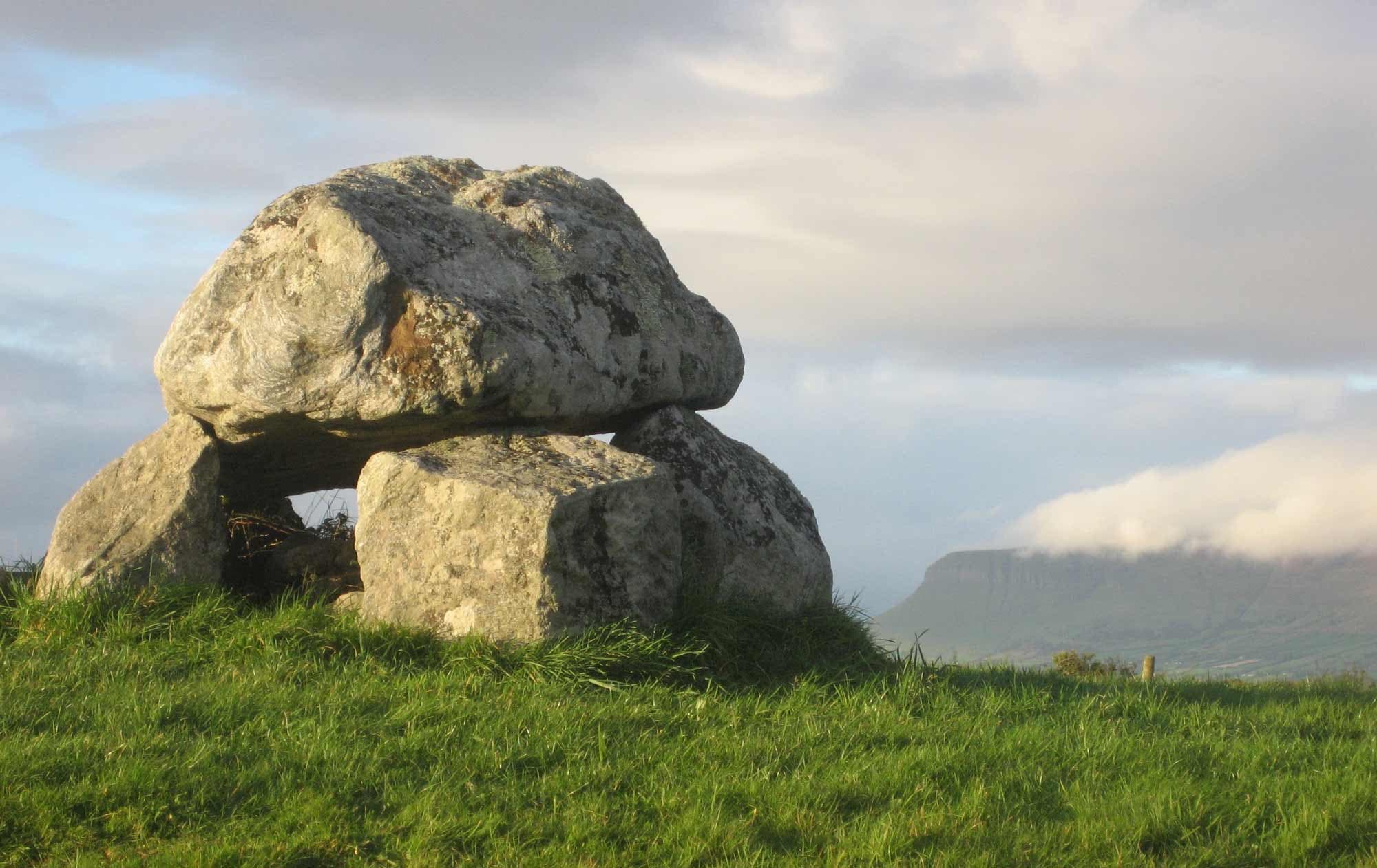 Carrowmore dolmen with cloud covered Ben Bulben in background