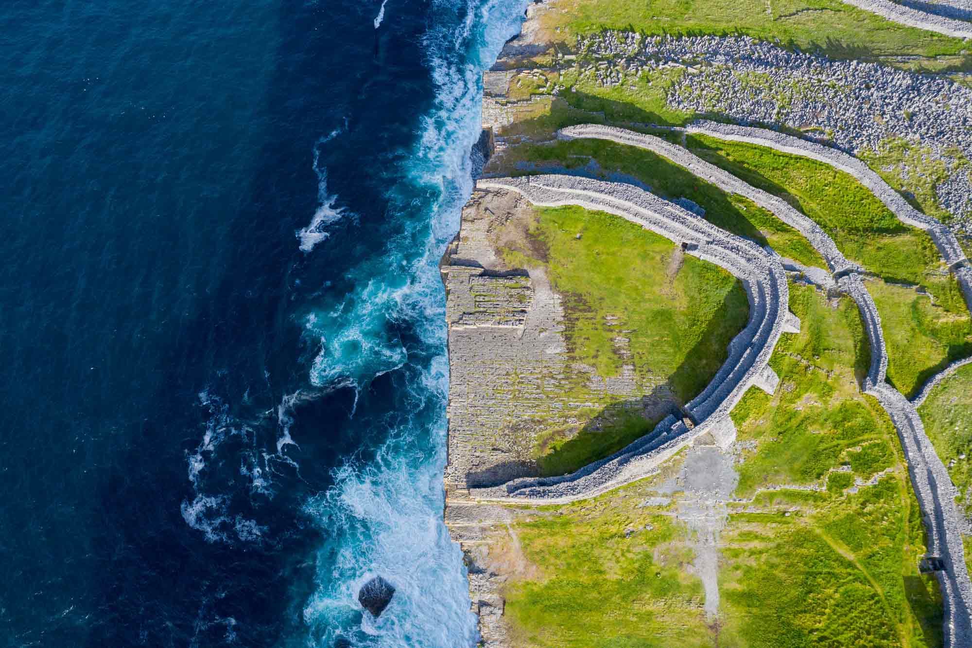 Aerial view of Dún Aonghasa perched dramatically on the cliff edge
