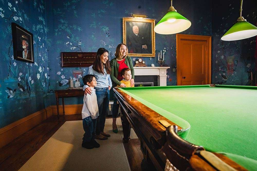 Victorian billiards room with period table and decor