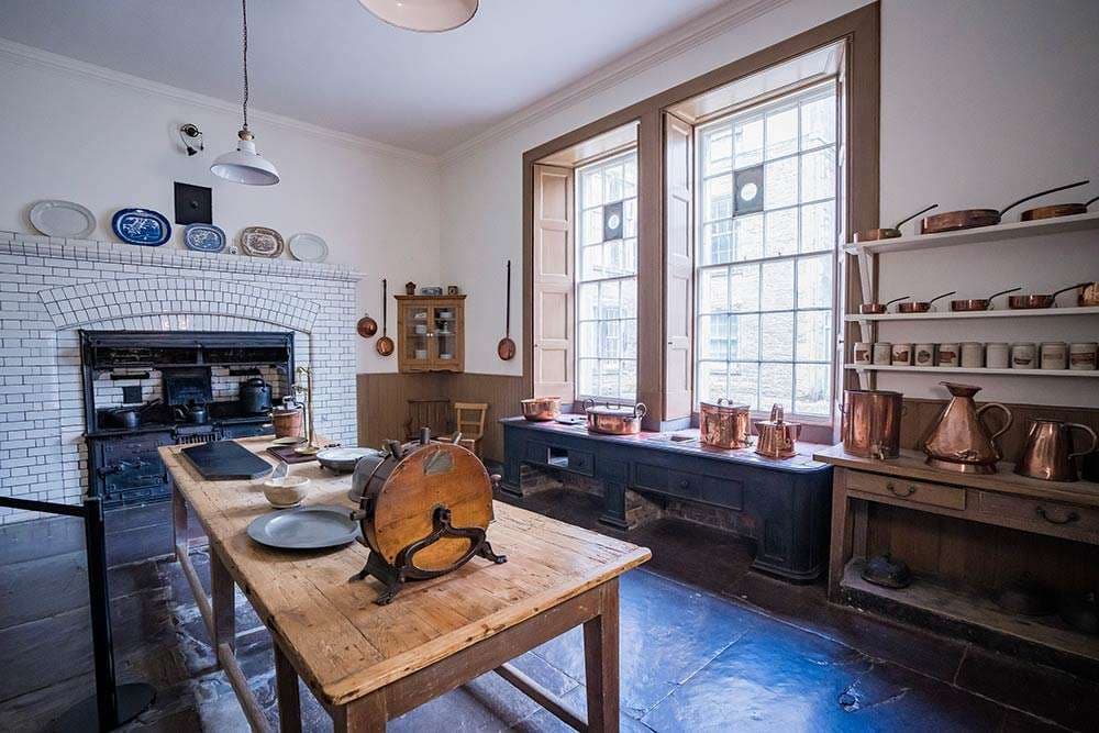 Victorian kitchen with copper pots and period equipment